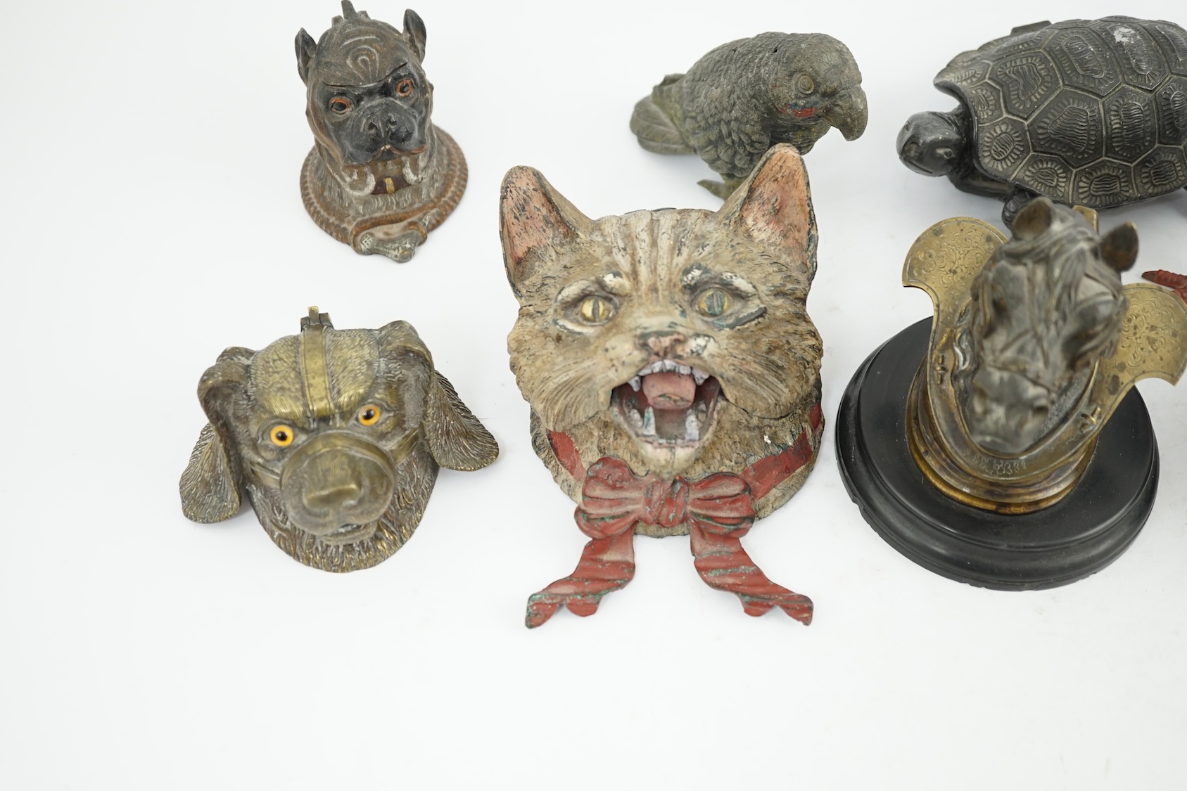 A collection ten 19th and 20th century novelty animal bronze and metal ink wells, including a Martin Brothers style ‘Wally’ inkwell